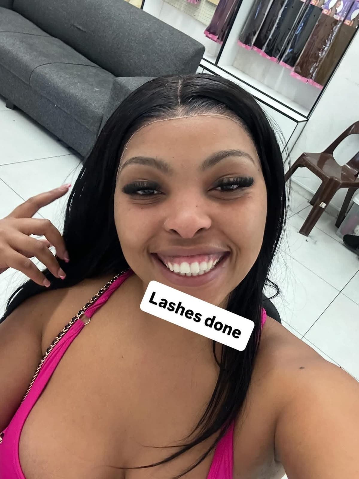 Client smiling with full volume lash extensions at the Cape Town studio